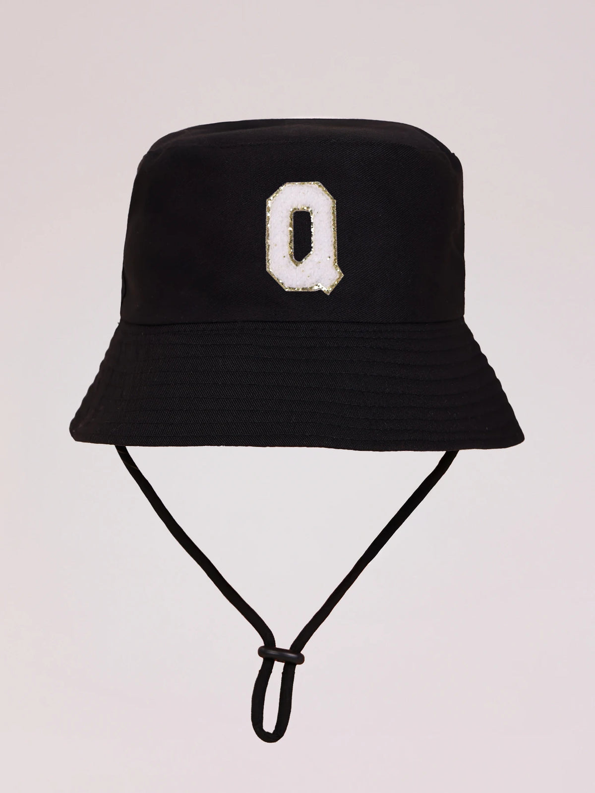 Black sun hat with a white letter O print and an adjustable cord