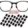 Un par de gafas negras y una hoja de 24 almohadillas nasales reutilizables antideslizantes.