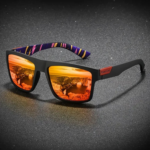 A pair of black vintage square sunglasses with an orange-tinted lens and a purple patterned temple.