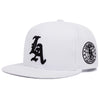 White embroidered cotton flat edge baseball cap featuring a black LA logo and an Los Angeles Cal periodic table design.
