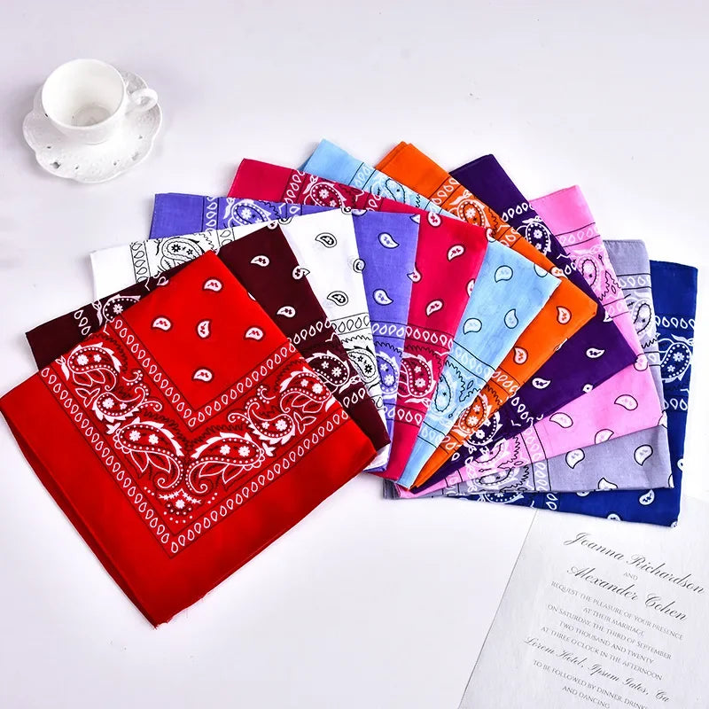 A colorful set of bohemian print bandanas and wrist wraps in various shades of pink, purple, blue, and orange.