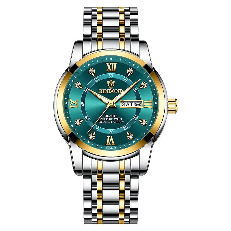 Reloj de hombre plateado y dorado con esfera verde azulada oscura, números romanos y marcadores luminosos.