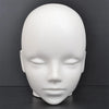 A white professional mannequin head used for practice and display.