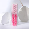 Pink satin ribbon bow hair clips displayed vertically against a white background.