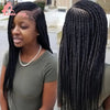 A woman models a 36-inch braided cornrow wig with long black hair, shown from the side and the back.