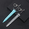 A silver dagger with a blue iridescent blade and hilt, attached to a keyring.