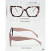 A pair of large, square-shaped fashion glasses with a leopard print frame and pink temples.