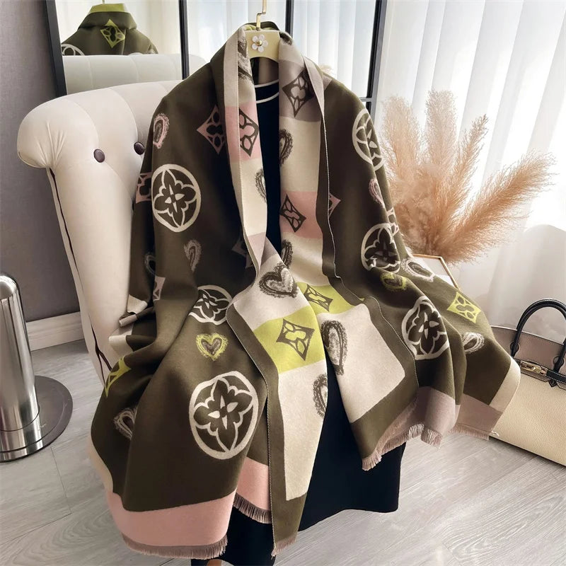 A luxury plaid cashmere feel scarf and shawl wrap in shades of olive green, beige, and pink fabric.