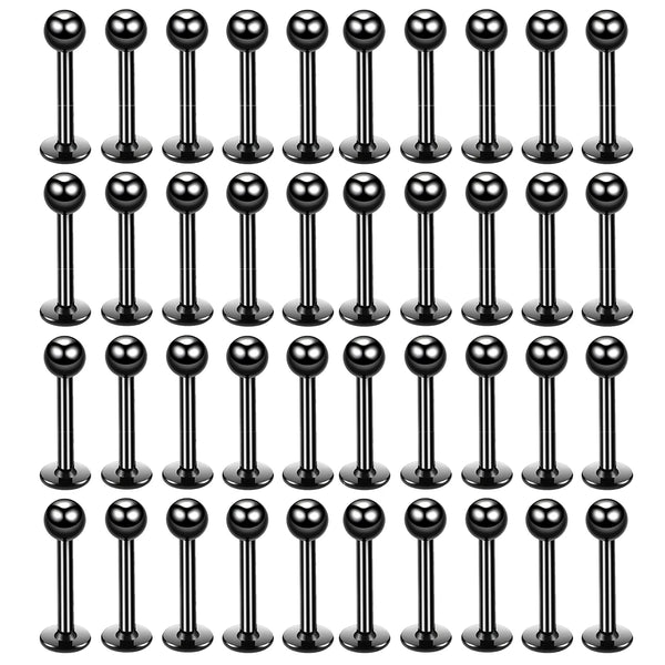 A grid of stainless steel labret lip rings for piercings.