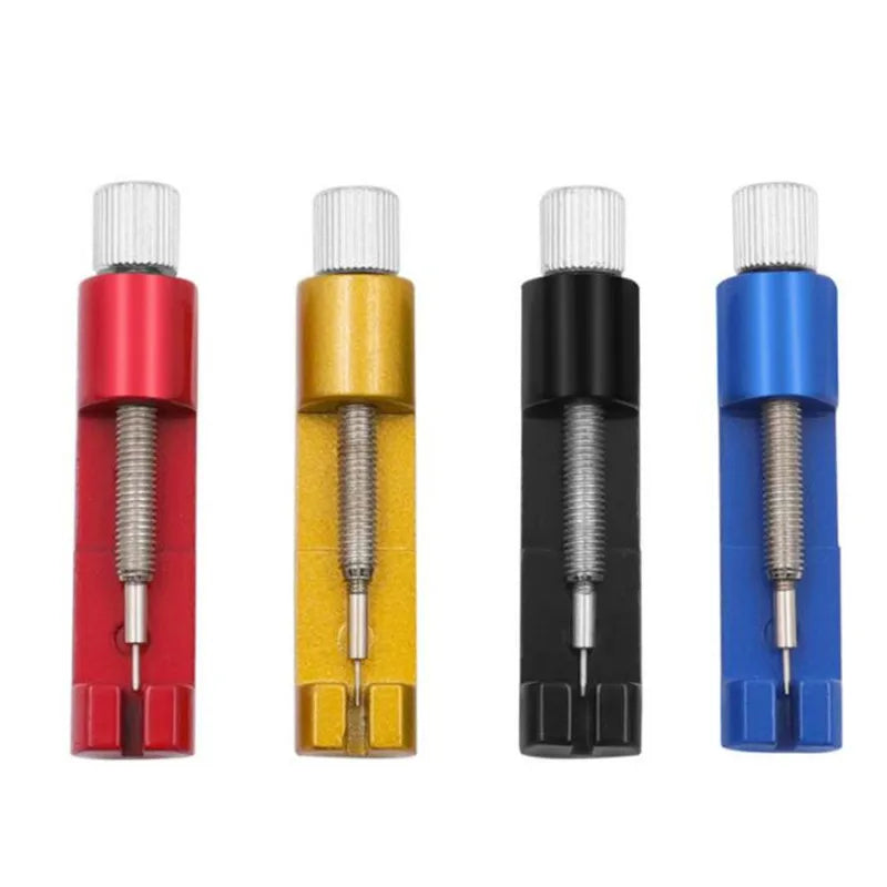 Four precision metal watch strap adjuster tools in red, yellow, black, and blue.