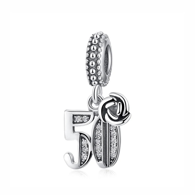 A silver family tree charm jewelry piece featuring the number 50.