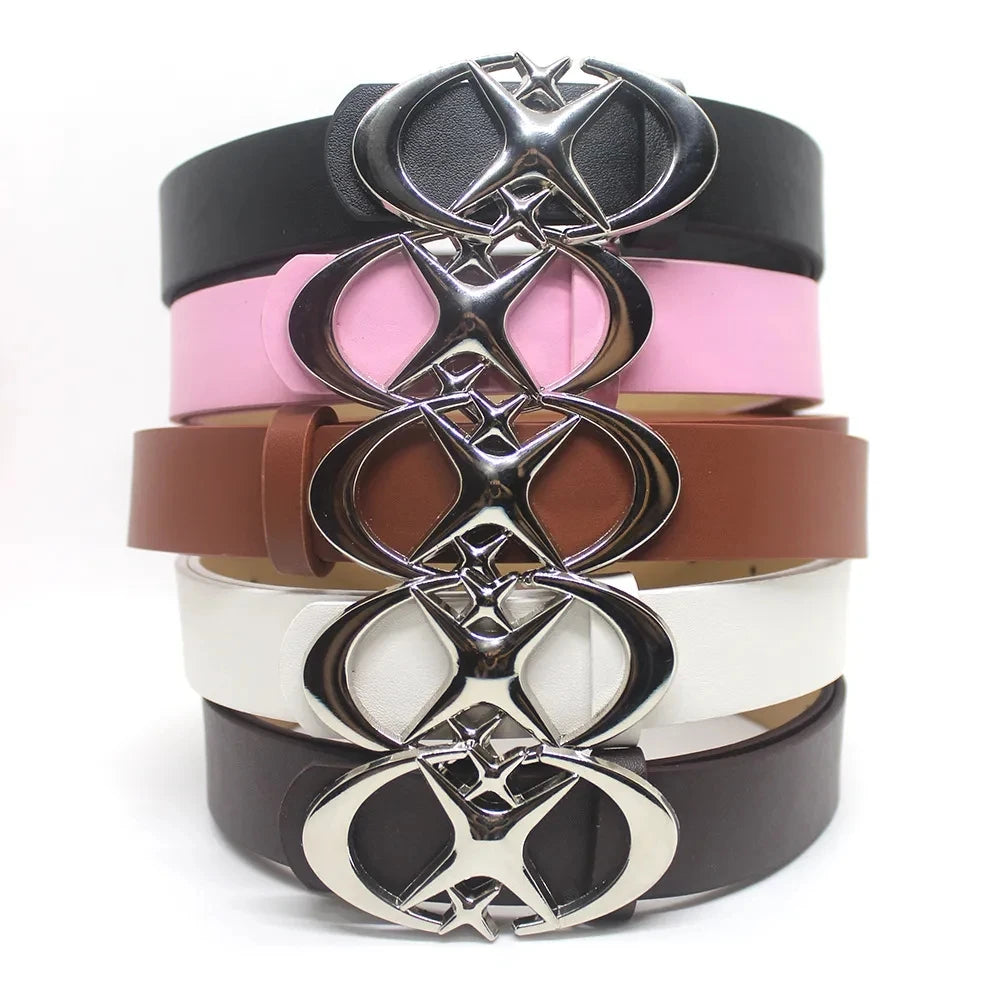 A stack of vintage gothic moon star buckle belts in black, pink, brown, white, and dark brown.