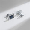 A pair of elegant silver cufflinks with a square, textured face and a hinged bar.