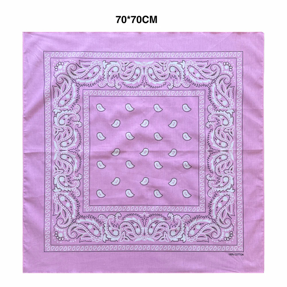 Pink cotton scarf with a purple paisley border and small white floral motifs