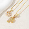 Gold-toned necklace set featuring CZ crystal pendants shaped like the letters I and D.