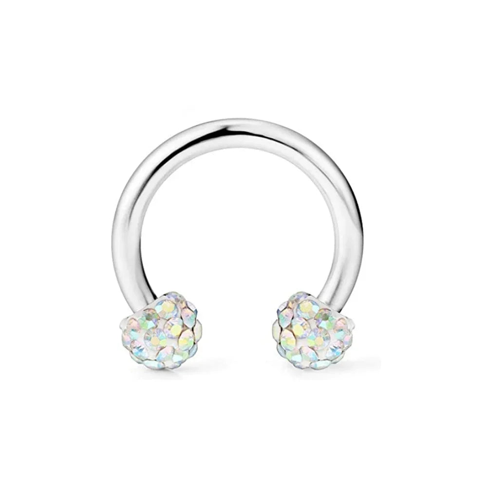 A set of crystal horseshoe barbell rings with surgical steel bodies.