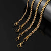 Gold stainless steel twisted chain bracelets displayed against a dark background
