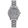 A silver-toned quartz watch with a crystal face and rhinestone bezel set in a metal bracelet.