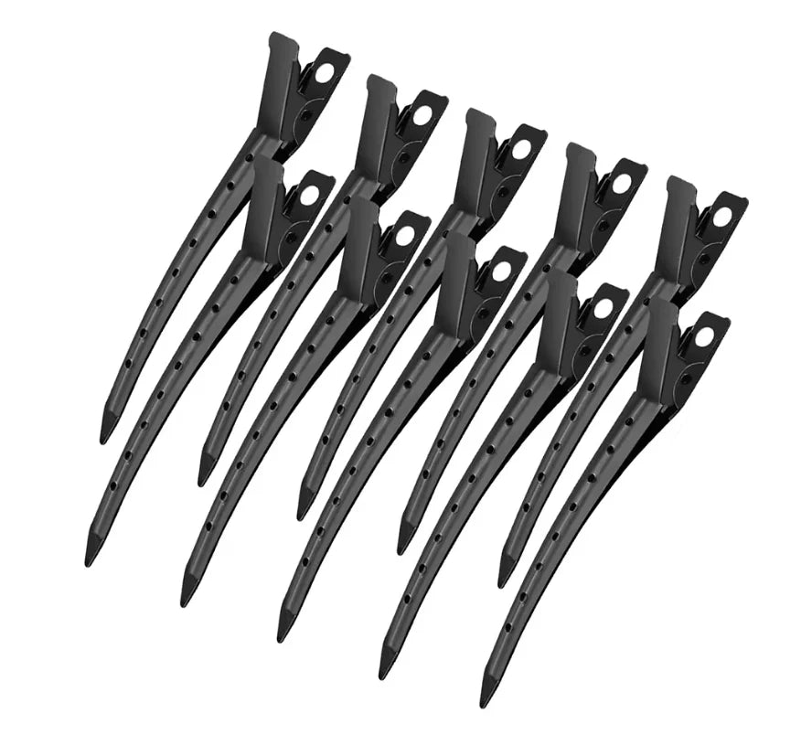 A set of black professional fixed hair pins for styling.