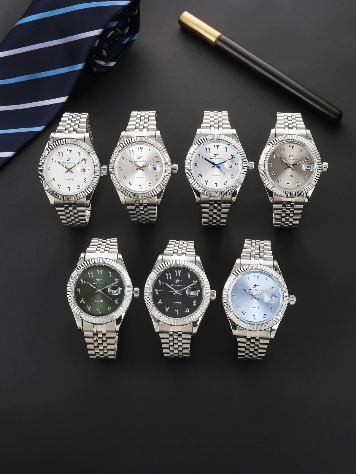 A collection of five luxury quartz men's wristwatches with metal bracelets and various dial colors displayed on a dark surfac