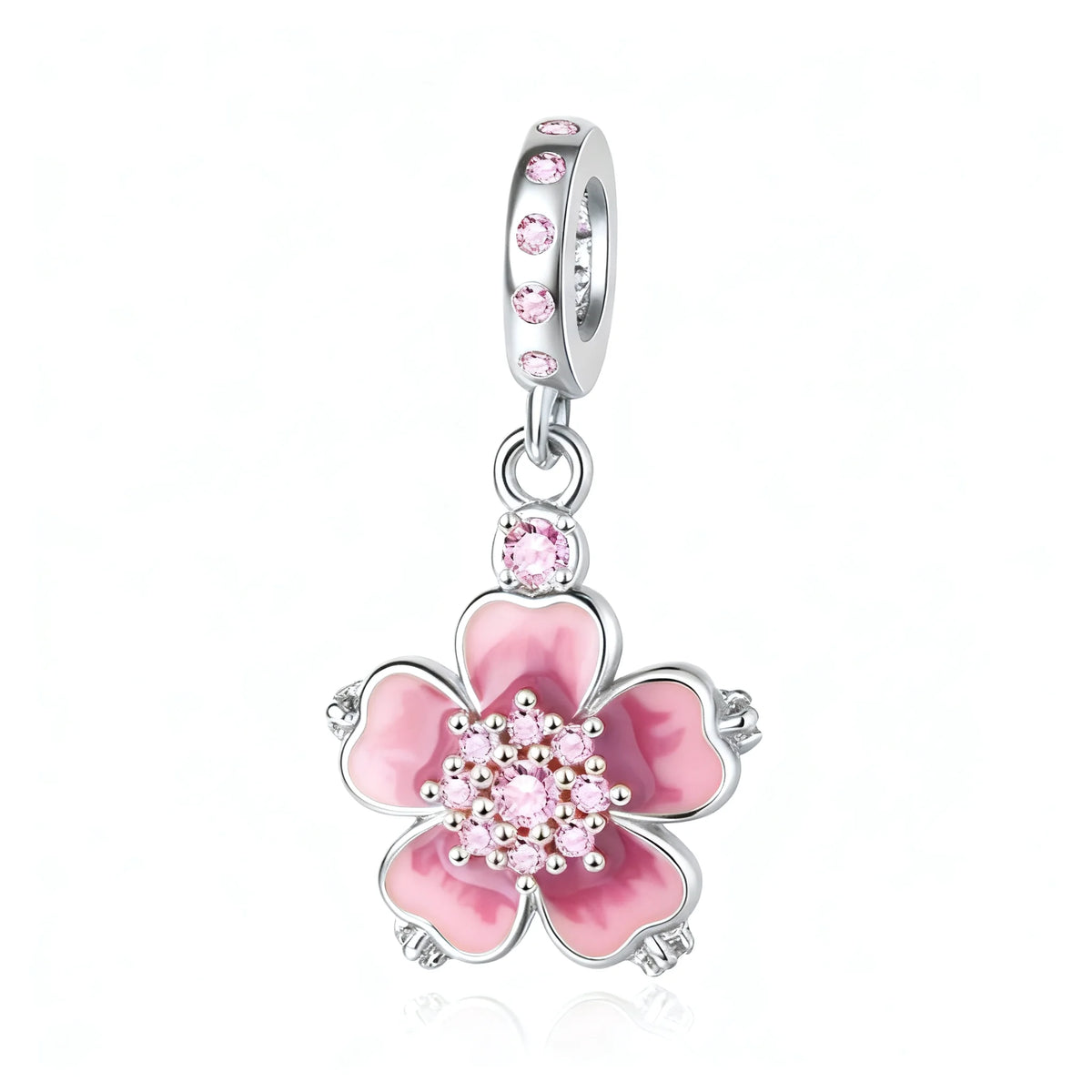 Pendientes colgantes plateados con un dije floral rosa y pequeñas piedras rosas y un aro de plata.