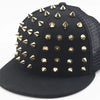 Black flat hat baseball cap adorned with gold-toned rivets and studs.