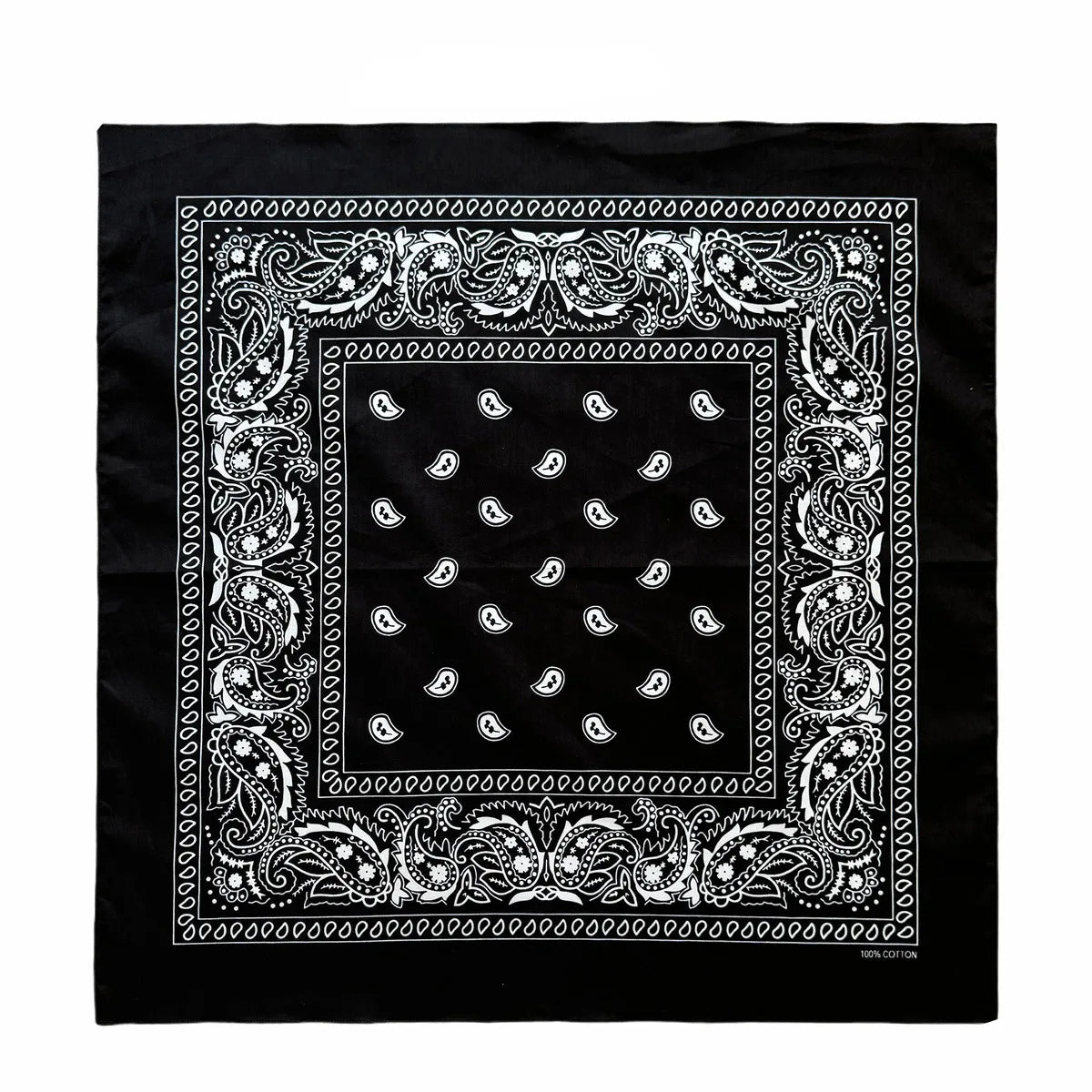 Black fabric with white paisley and floral embroidery pattern on a square design