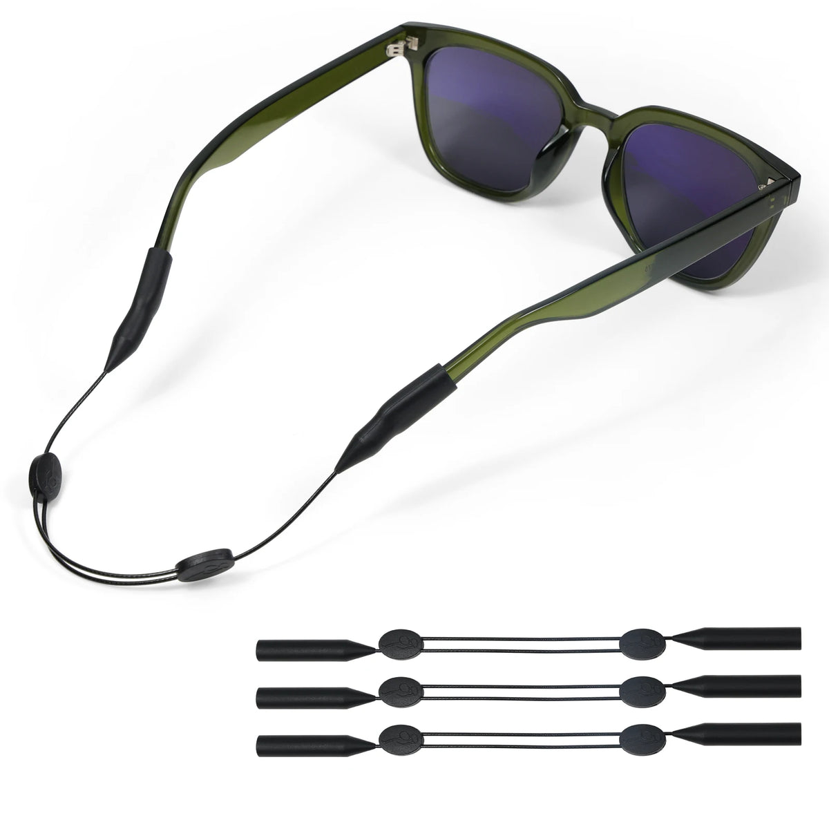 A pair of olive green sunglasses with black adjustable retainer straps shown alongside separate strap components.