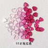 A collection of 10 pink and red resin heart-shaped nail art charms.
