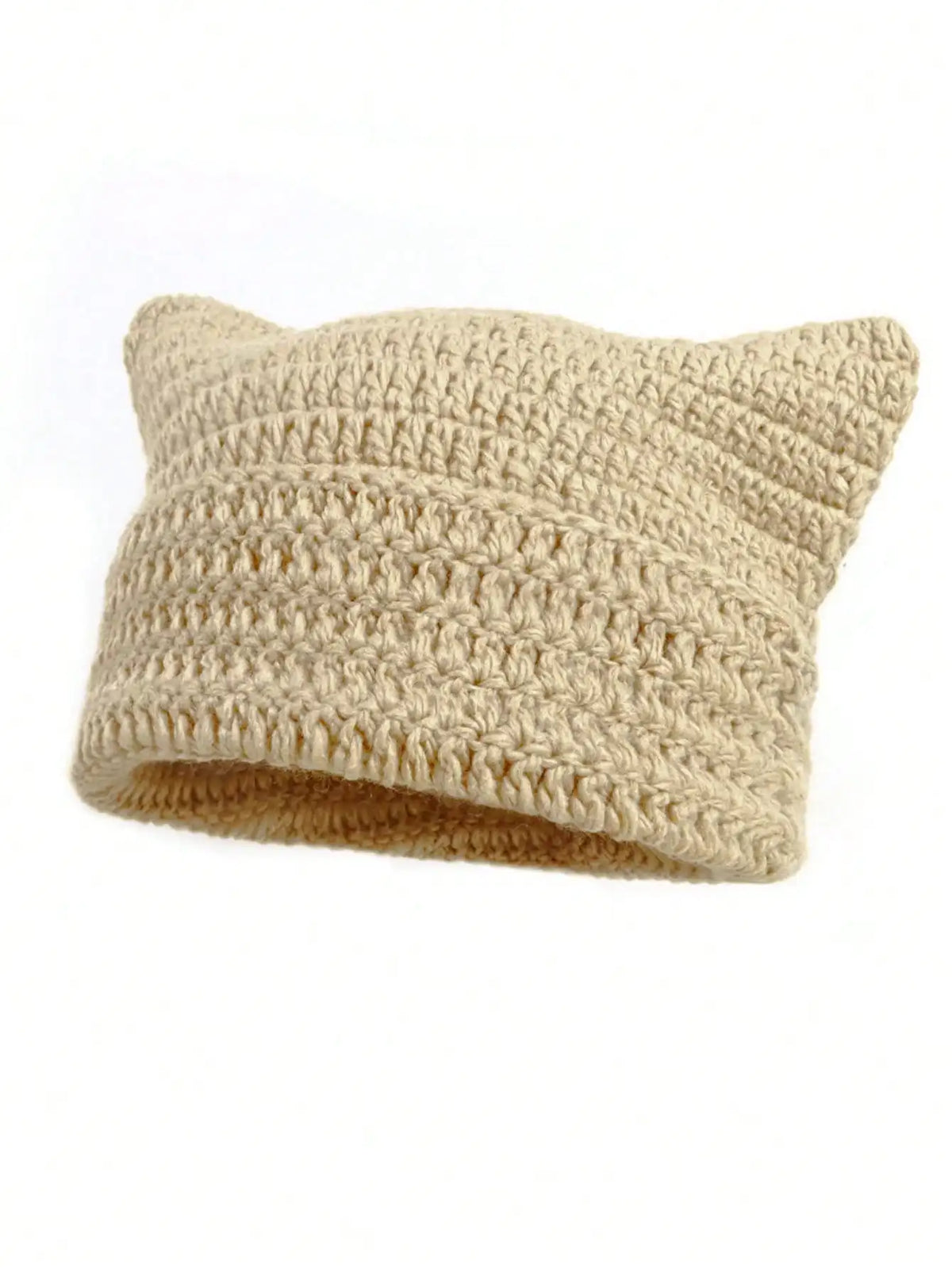A beige crocheted beanie hat with cat ear style ears.