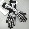 Black gloves with white skeleton print on the palm and back, displayed on a light surface.