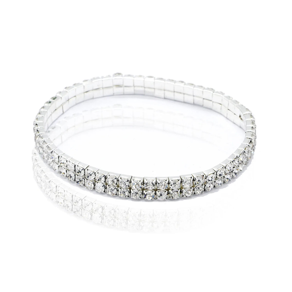 A stack of multi-layer crystal tennis anklets for women, featuring sparkling clear stones.