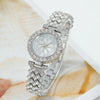 Silver rhinestone quartz watch and bracelet set featuring a detailed watch and matching bracelet