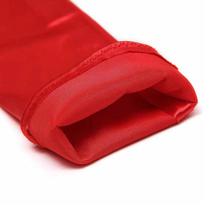 A close-up of a red satin fingerless glove folded and displayed.