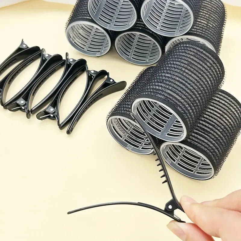 A set of 18 self-gripping hair rollers for curling, showing various sizes and a black metal tool.