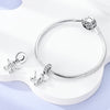 Sterling silver devil's eye charm bracelet displayed on a white surface.