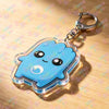 A clear blue cloud shaped keychain charm with a smiling face and a globe detail on a silver keyring.