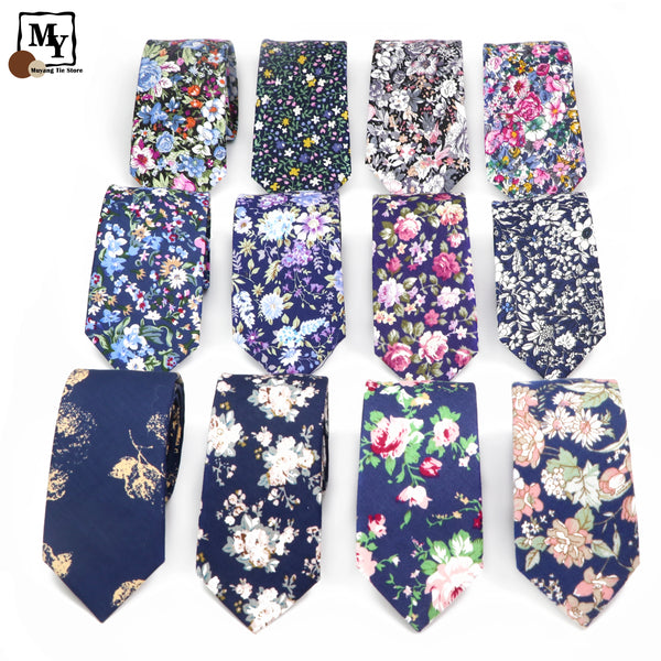 A collection of nine elegant floral printed cotton neck ties in various patterns and colors.