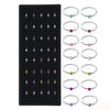 A set of stainless steel nose studs and rings for body piercing, featuring various designs.