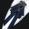 A dark blue luxury rhinestone bow tie neck tie with silver accents and a black gemstone detail.