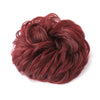 A mass of reddish-brown hair styled into a messy bun or updo.