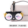 Black cat-themed PU leather pouch with yellow ears and pink/purple eyes attached to a light beige handbag.