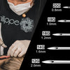 A close-up of a person using disposable sterile piercing needles of various gauges and lengths.