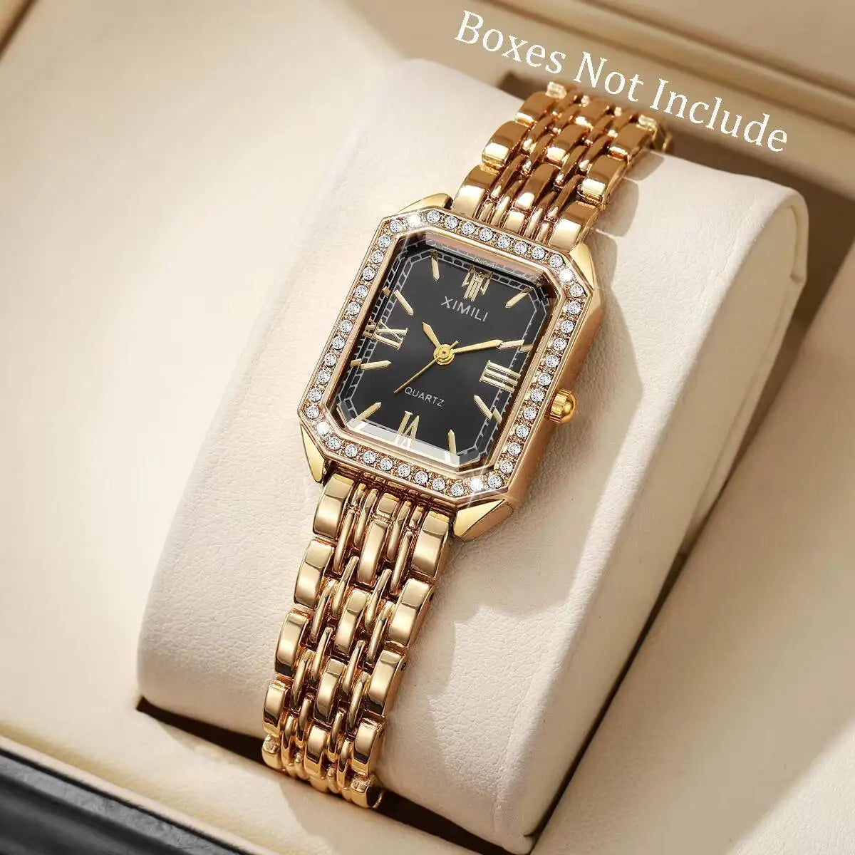 A gold-toned rhinestone quartz wristwatch with a square face and metal bracelet displayed on a light background.