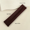 A dark brown fabric headband is shown next to a white, wavy surface, with dimensions provided.