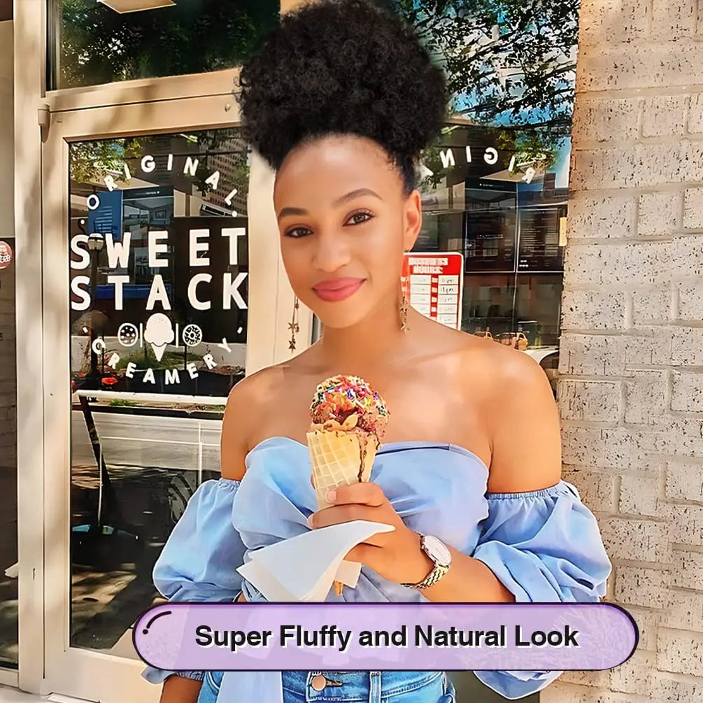 A woman with natural hair styled in a super fluffy and natural look, holding a waffle cone.