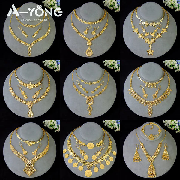A set of luxury gold plated bridal jewelry featuring necklaces and earrings displayed on a stand.