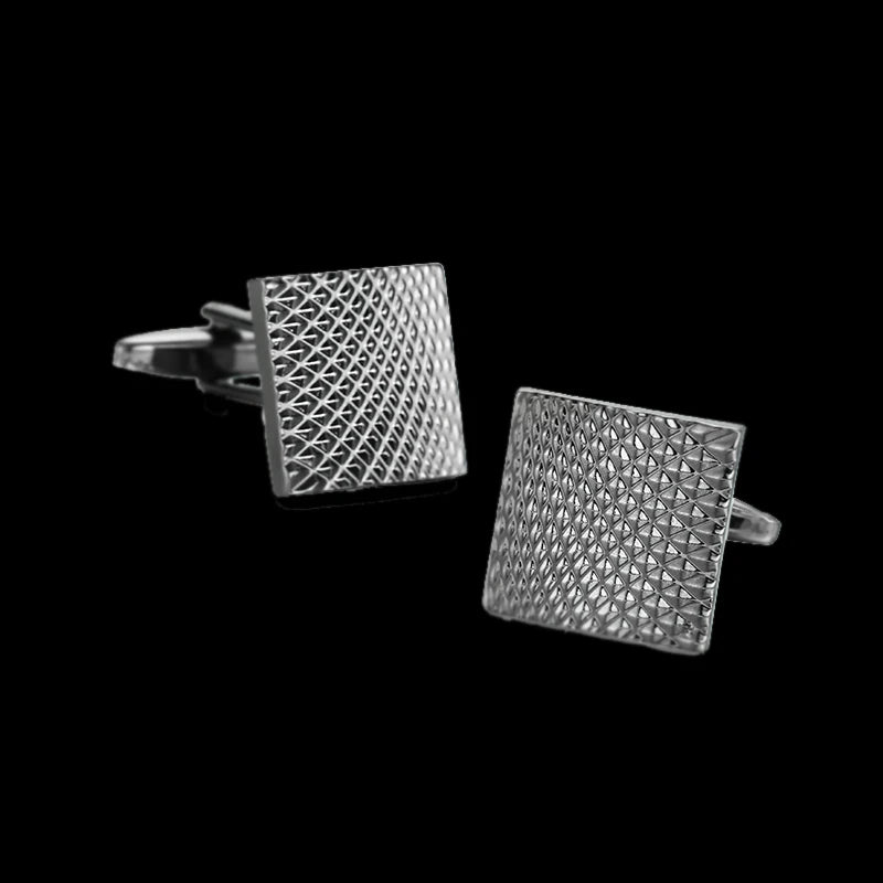 A pair of men's classic copper square cufflinks with a textured, geometric pattern.