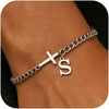 A close-up of a personalized stainless steel cross Cuban chain bracelet worn on a wrist.