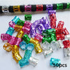 A collection of colorful metal hair rings and clips in various shades including pink, purple, green, and red.